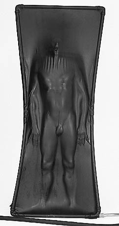 Male body inside vacuum bed