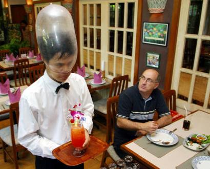 waiter with condom on head