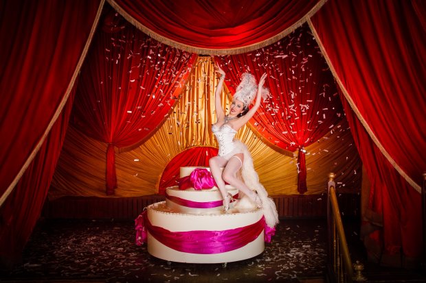 Burlesque girl in a cake